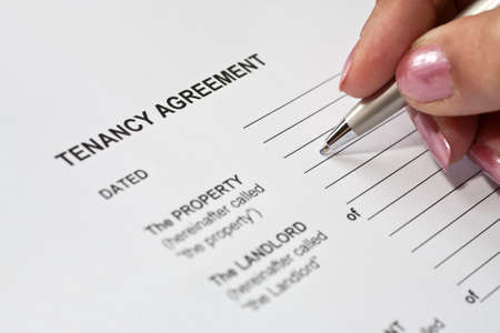 Lady completing a tenancy agreement formの写真素材