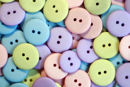 A collection of pastel colored buttonsの写真素材