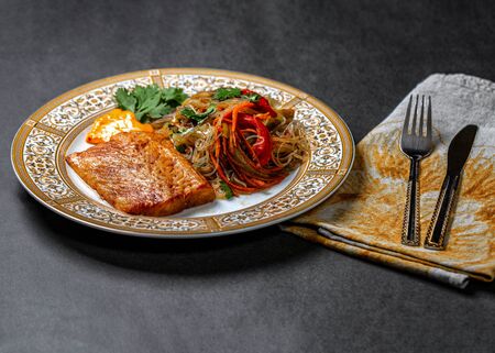 Grilled halibut steak with vegetablesの写真素材