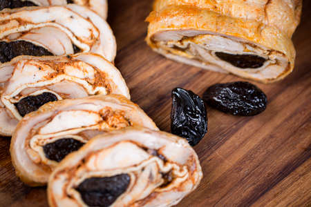 Rolls with chicken and prunes. In breaded.