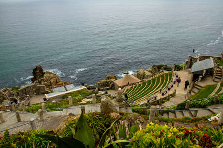Penzance, UK 03/10/2010: Aerial view  of the Minack Theatre, a unique amphitheater carved in a rocky slope by Atlantic ocean. This terraced stone building is a very popular performance destination.のeditorial素材