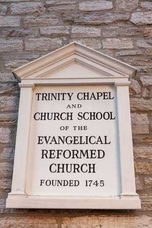 Frederick, MD, USA 10/14/2020: Plate on the wall of the historic  complex in Frederick which includes Trinity chapel, church school and Evangelical Reformed United Church of Christ founded in 1745.のeditorial素材