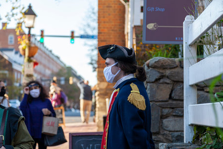Alexandria, VA, USA 11-28-2020: An employee working at the visitor center of touristic historic...