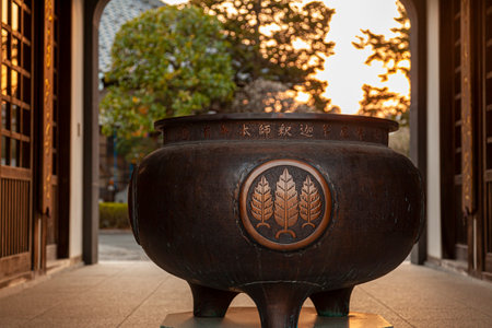 Sendai, Japan 03-08-2019: A historic large bronze pot with artistic motifs and Japanese inscriptions...