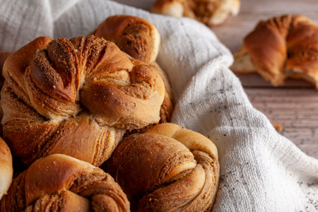 Traditional Turkish hashasli corek. A croissant like pastry roll with poppy seed paste inside. A...