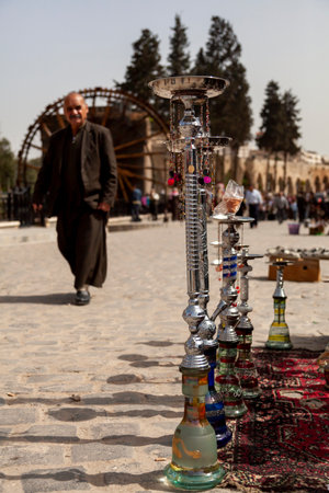 Hama, Syria 04-02-2010: glass hookah appartuses on display of a street vendor in touristic destination in Hama, Syria. These are ornamental vaping tools common in middle east.のeditorial素材