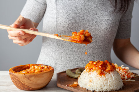 Fasolada, Bean stew over rice pilaf known as Pilav ustu kuru fasulye is a popular dish in Turkey. Haricot beans stewed with spice and tomato sauce is transferred on top of butter cooked rice pilau.の写真素材