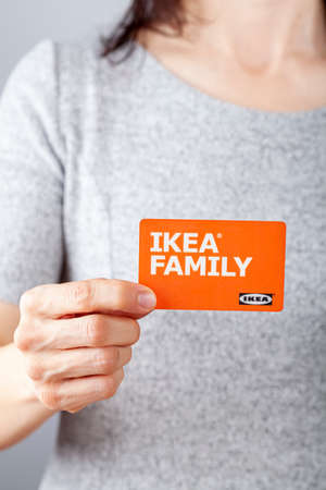 Clarksburg, MD, USA 02-25-2021: A caucasian woman is holding an Ikea Family membership card in her...