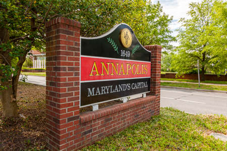 Welcome sign at the entrance of Annapolis, Maryland which has the coat of arms of the city, the...
