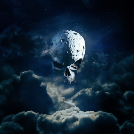Reaper moon rising / 3D render of cratered skull moon in night skyの写真素材