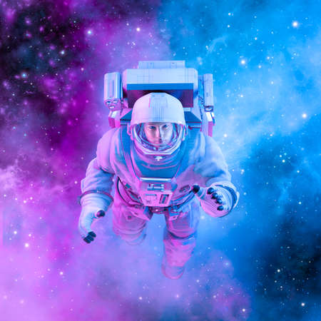 Peaceful female astronaut - 3D illustration of woman in space suit floating inside softly glowing pink and blue galactic cloudの写真素材