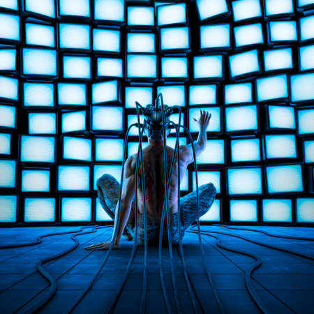 Digital information overload - 3D illustration of male figure wearing virtual reality helmet sitting in front of wall of glowing blank computer monitorsの写真素材