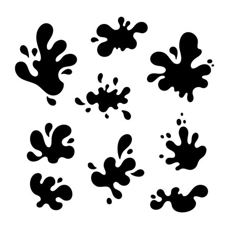 A collection of abstract black ink splatter shapes in a silhouette style, presented isolated on a clean white background.のイラスト素材