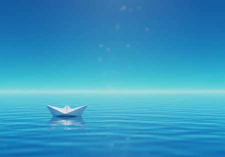 A solitary white paper boat floats serenely on the tranquil blue ocean, reflecting the distant, faint stars in the clear sky.の素材