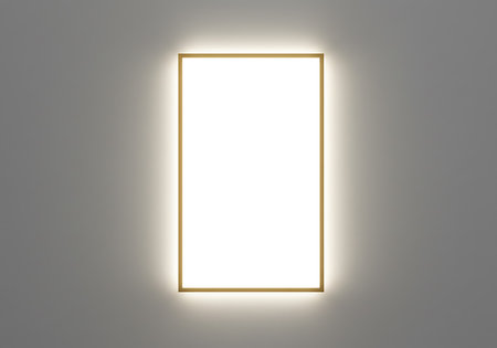 A contemporary rectangular wall light fixture emits a warm, inviting illumination against a neutral background.の素材