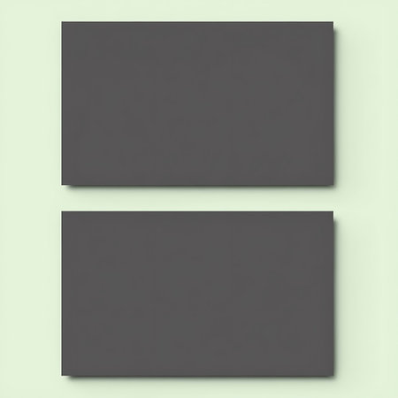 A minimalist composition featuring two identical dark gray rectangular shapes presented vertically against a pale green backdrop.の素材
