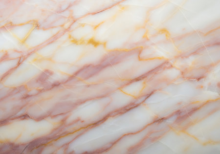 A close up view of a natural stone surface with delicate pink and gold veins.の素材