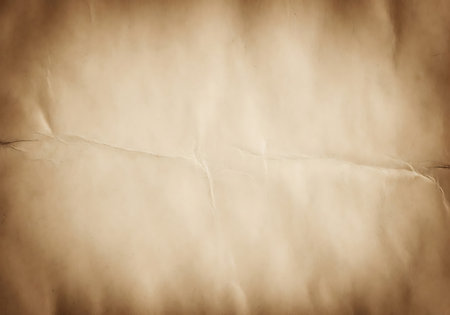 Close-up view of a textured, aged parchment background with visible creases and a warm, faded brown hue.の素材