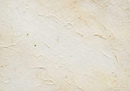 A close-up view of a textured surface with subtle variations in cream and beige hues, creating a soft and natural feel.の素材