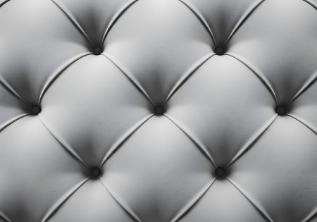 Detailed view of diamond-patterned tufted fabric, showcasing depth and rich texture. Elegant and sophisticated.の素材