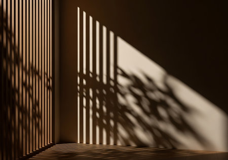 Sunlight filters through vertical blinds, creating stark lines and abstract shadow patterns on a wall.の素材