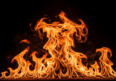 Intense, fiery orange flames with intricate patterns and a black backdrop. A powerful display of heat and light.の素材