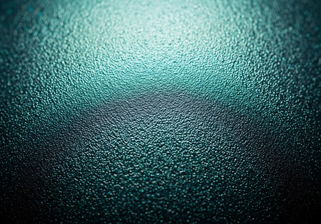 A dark, textured surface with a bright, ethereal glow emanating from the top, creating a moody and atmospheric effect.の素材