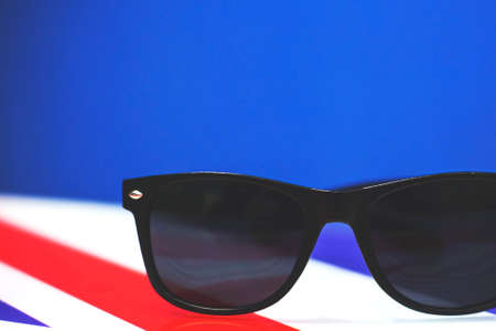 black fashion sunglasses on the table, retro tonedの写真素材