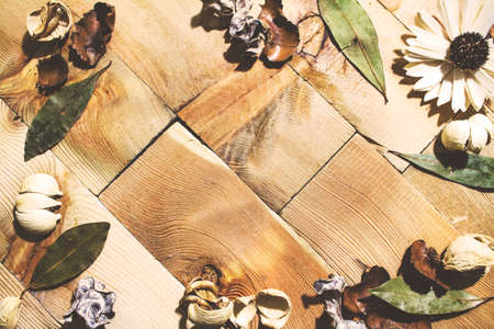 A frame of flower on a wood background texture, retro tonedの写真素材