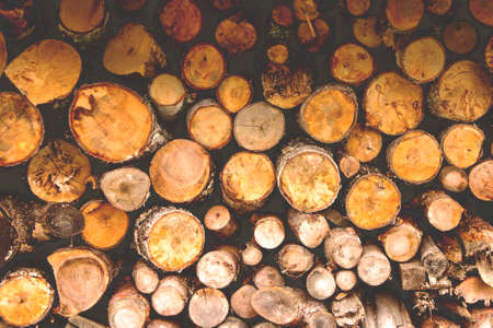 a bundle of firewood for the winter background texture, retro tonedの写真素材