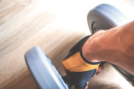 Dumbbell in hand, retro tonedの写真素材