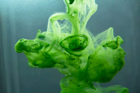 Abstract paint patterns in waterの写真素材