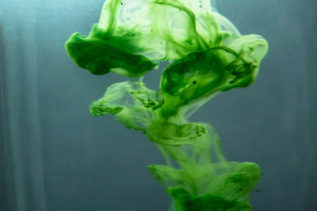 Abstract paint patterns in waterの写真素材
