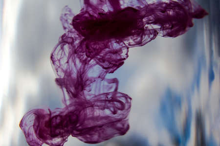 Abstract paint patterns in waterの写真素材