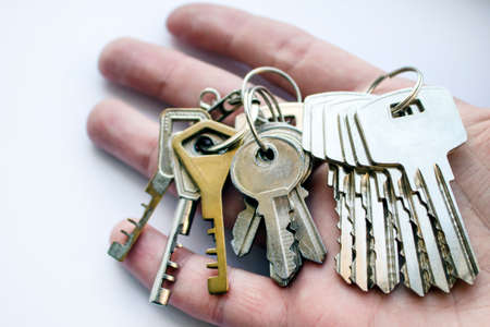 A bunch of door keys on hand