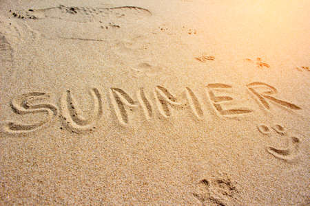 Summer inscription on the sandの写真素材