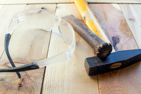 Chisel hammer and safety glasses
