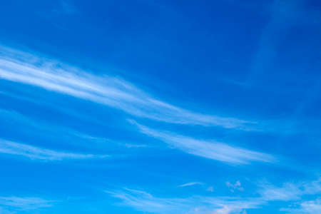 Light cirrus clouds on the blue sky