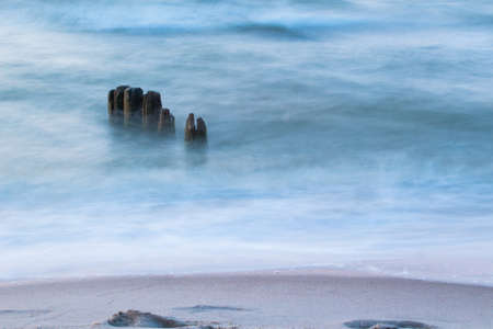 Breakwaters in the sea on long exposure