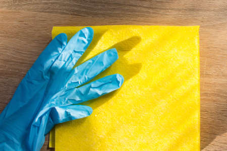 rubber glove and yellow cleaning clothの写真素材