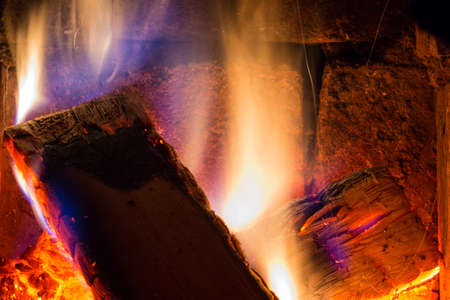 Firewood burning in the fireplace