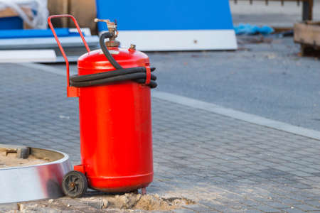 large red industrial fire extinguisher