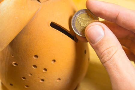 to put a coin in a coin box