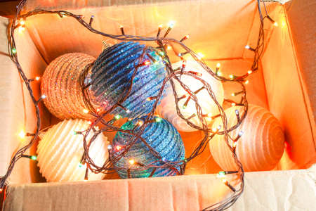 Christmas toys and a garland in a box