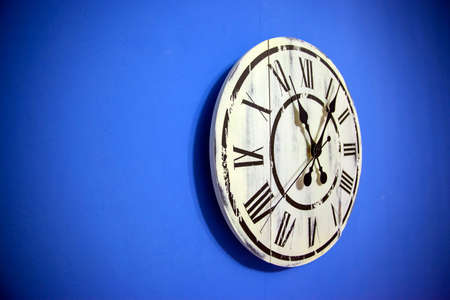 wall clock on a blue background