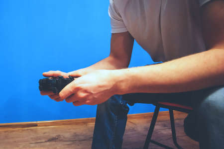 the young guy plays in the console, toned