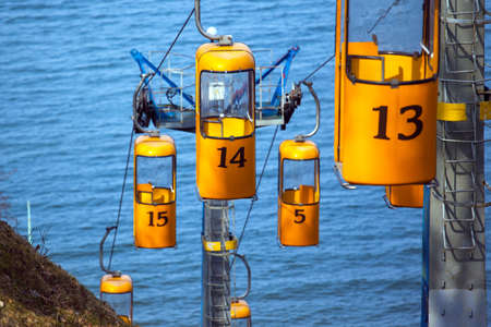 yellow funiculars near the sea