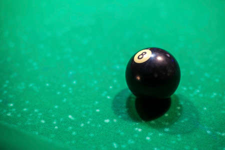 black billiard ball on the table, number 8