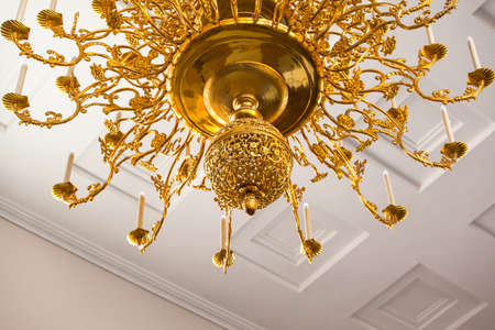 beautiful large gold chandelier with ornament