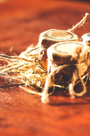 small jars with honey and nuts, retro toned